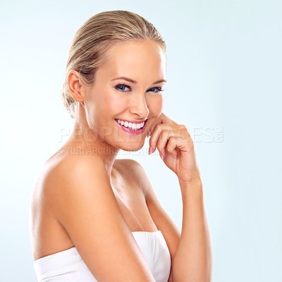 Buy stock photo Happy, beauty and portrait of woman in studio for skincare, dermatology treatment or facial glow. Female person, smile and makeup with confidence with self care, shine or wellness on blue background