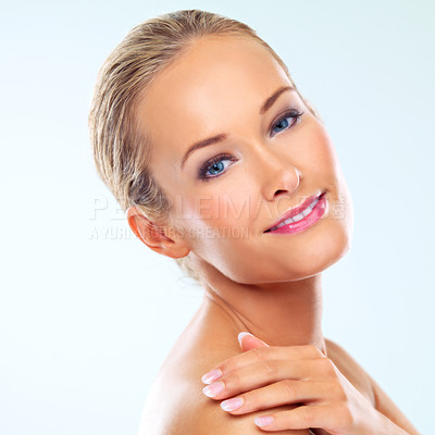 Buy stock photo Portrait, smile and skincare of woman, beauty or shine for health isolated on a blue studio background. Face, makeup and young blonde model in cosmetics for facial dermatology, wellness or aesthetic
