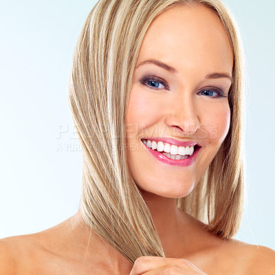 Buy stock photo Portrait, hair care and beauty of happy woman in makeup at studio for glow, shine or health isolated on blue background. Face, hairstyle and blonde model in cosmetics at hairdresser or salon for skin