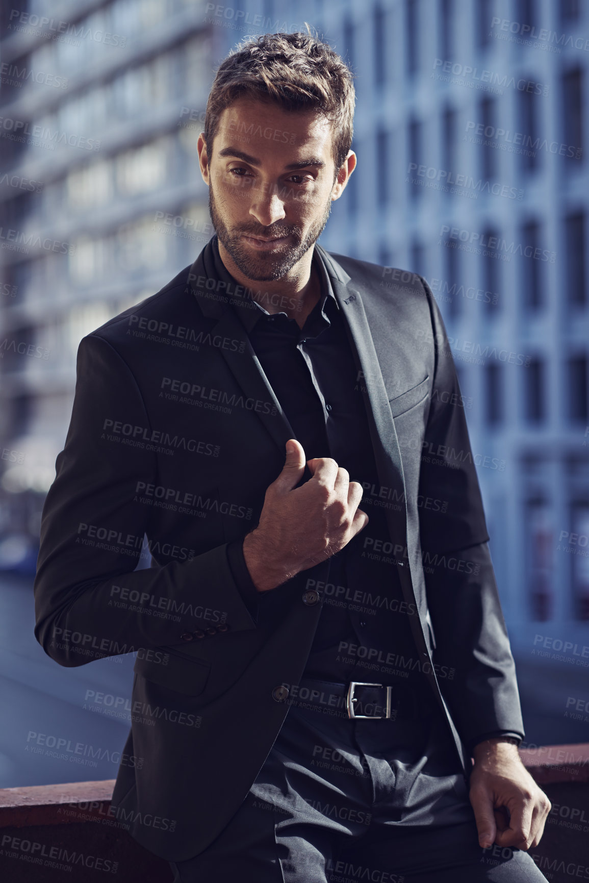 Buy stock photo Confident, style and businessman on balcony in suit and formal fashion for professional in city. Young entrepreneur, pride or confidence for business in property, job or ambition of friendly realtor