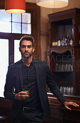 Buy stock photo Young Businessman, portrait and alcohol for break in hotel and drink to relax on corporate trip. Entrepreneur, pub and confident face by glass of whisky for leisure and professional for work travel