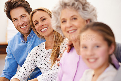 Buy stock photo Generations, portrait and family with smile, home and relax on sofa of living room for bonding. Girl, mother and father with grandma for visit with daughter or child with happiness on couch of house