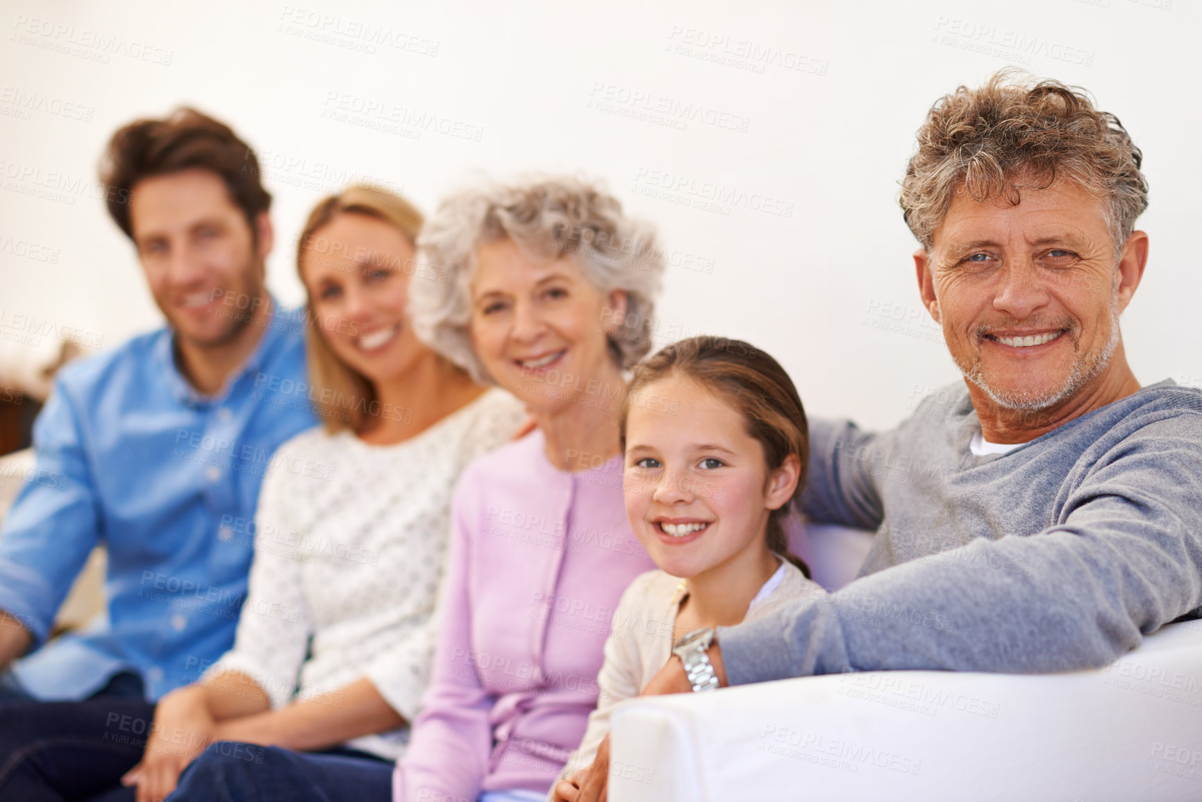 Buy stock photo Portrait of a cheerful multi generational family smiling together