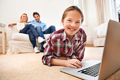 Buy stock photo Parents, portrait or girl with laptop for elearning or studying for remote education on carpet at home. Relax, father or mother with family blur, smile or happy child streaming video, film or movies