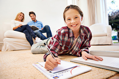Buy stock photo Portrait, parents or girl writing homework in school notebook for education or assignment on carpet. Smile, floor or female kid in a house for learning, creativity or studying for child development
