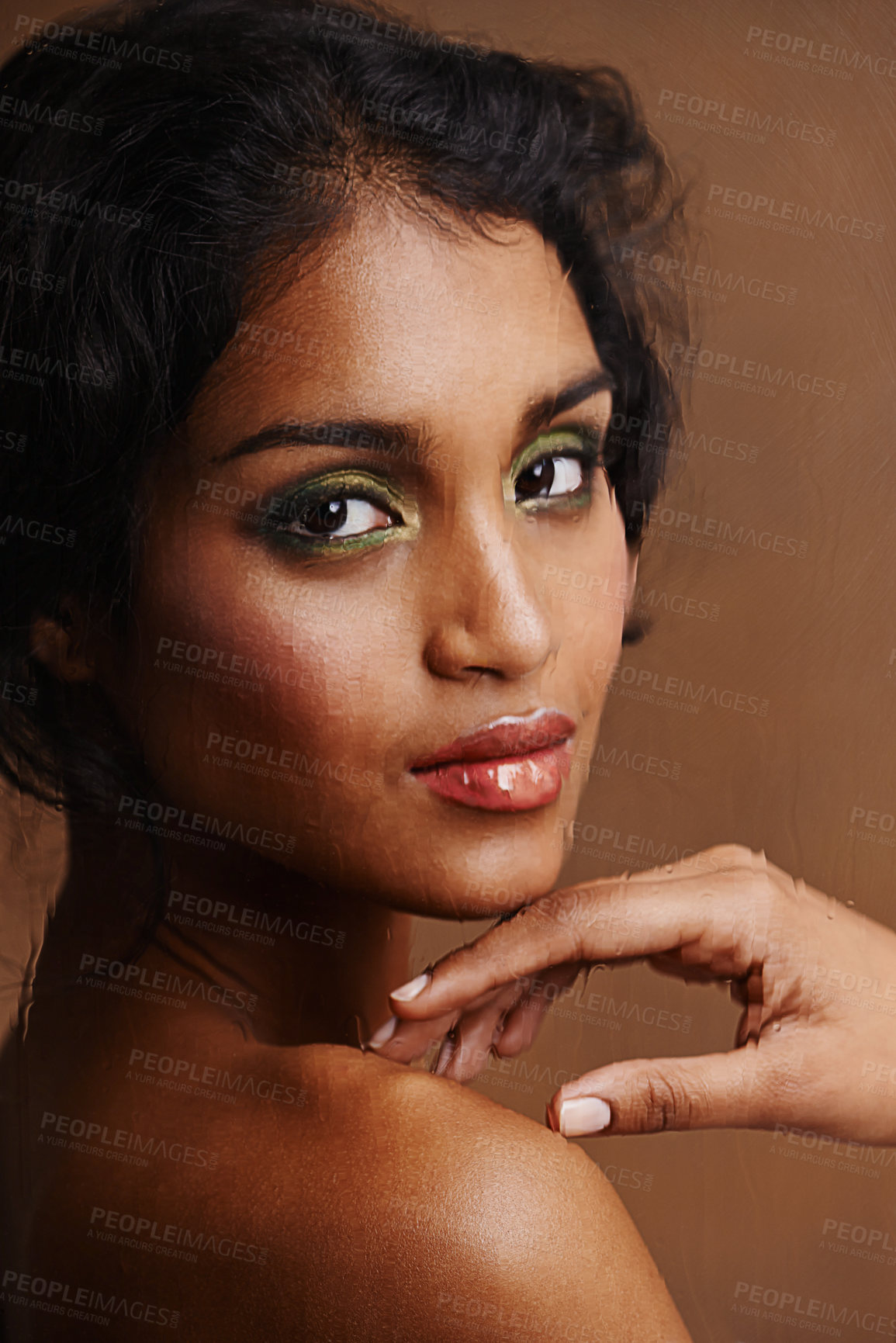 Buy stock photo Studio shot of a beautiful young woman against a brown background