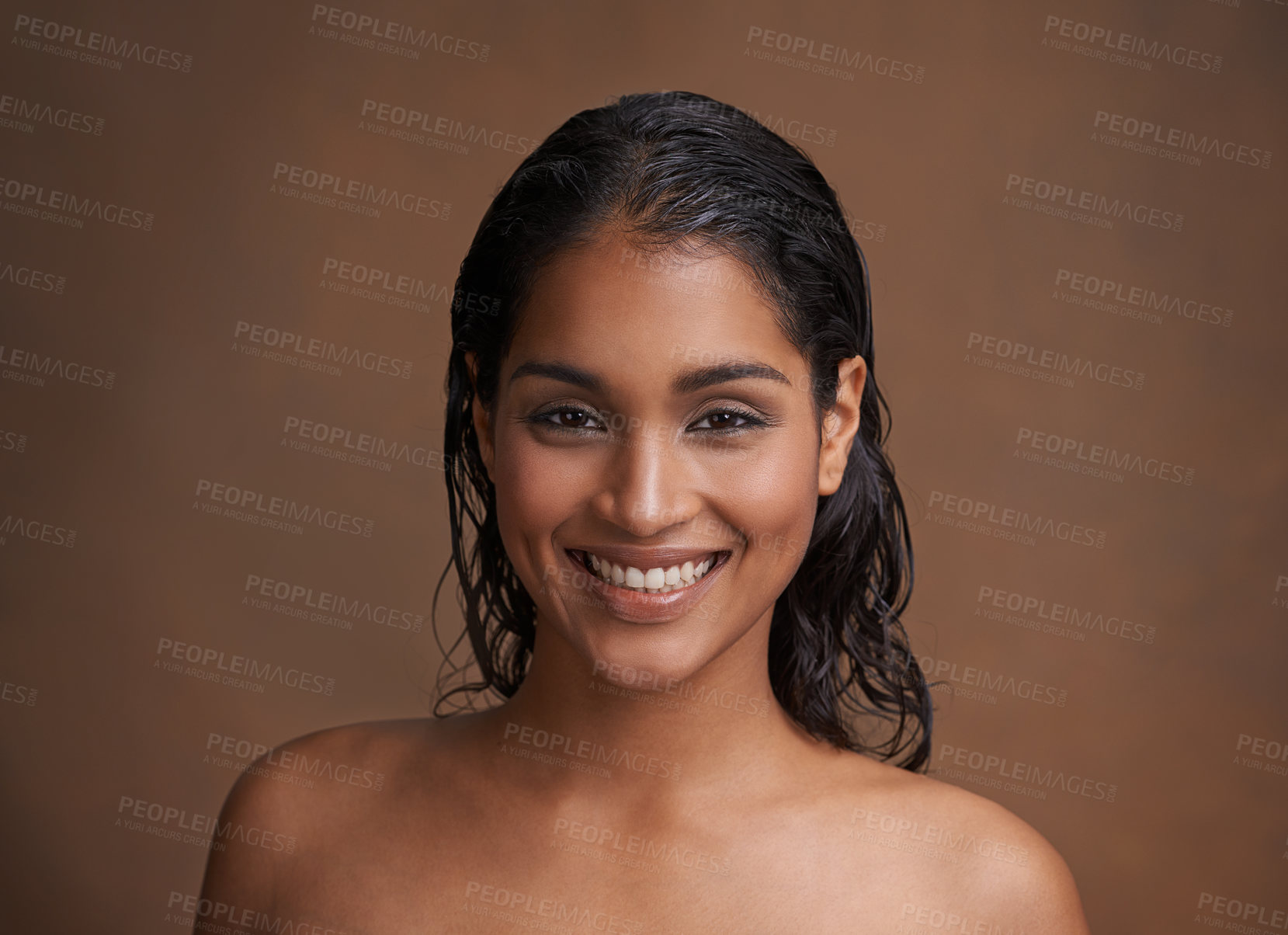 Buy stock photo Hair, wet or portrait of happy woman in studio for beauty, wellness or shine cosmetics on brown background. Haircare, cleaning or face of Indian female model smile for shampoo, results or scalp detox