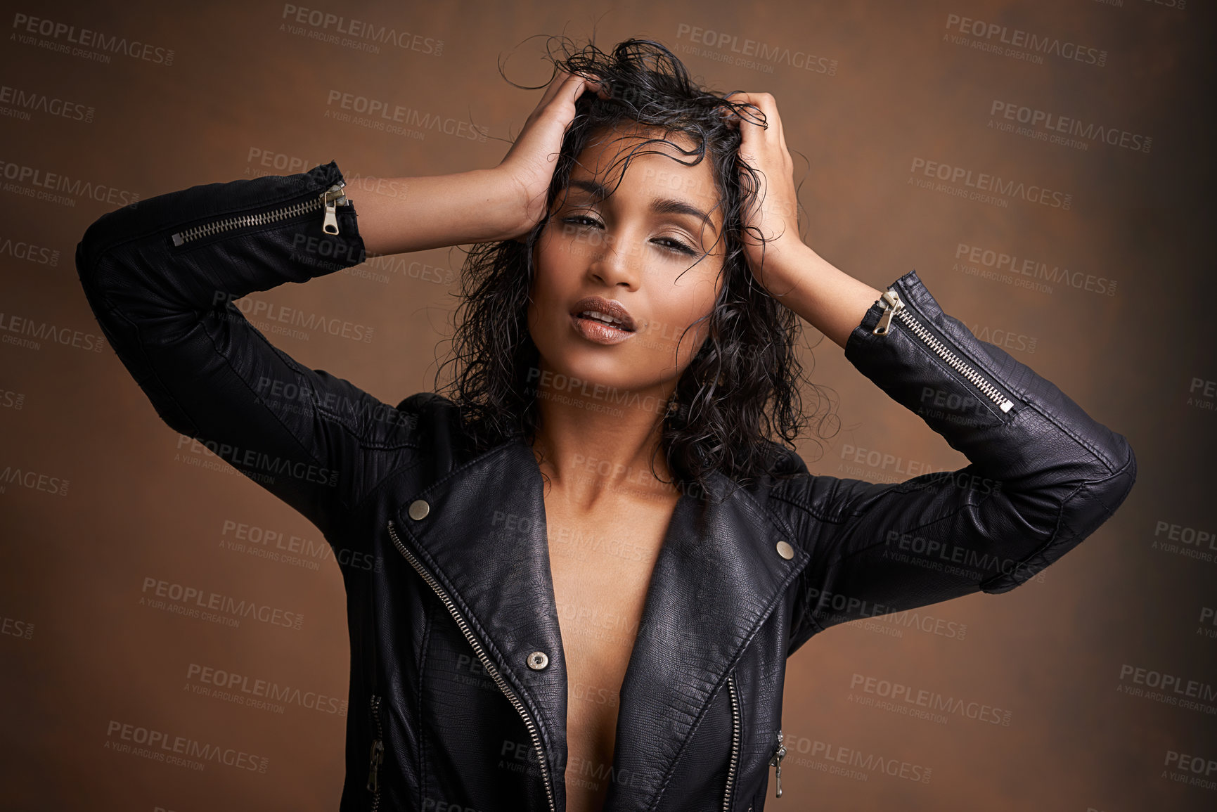 Buy stock photo Woman, fashion and portrait in studio with leather jacket and beauty with makeup for bold, and chic. Indian person, model and edgy with curls and clothes for aesthetic and style for trend and cool 