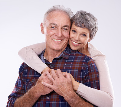 Buy stock photo Love, hug and portrait of senior couple on a white background for bonding, affection and loving relationship. Marriage, happy and mature man and woman embrace for commitment, trust and care in studio
