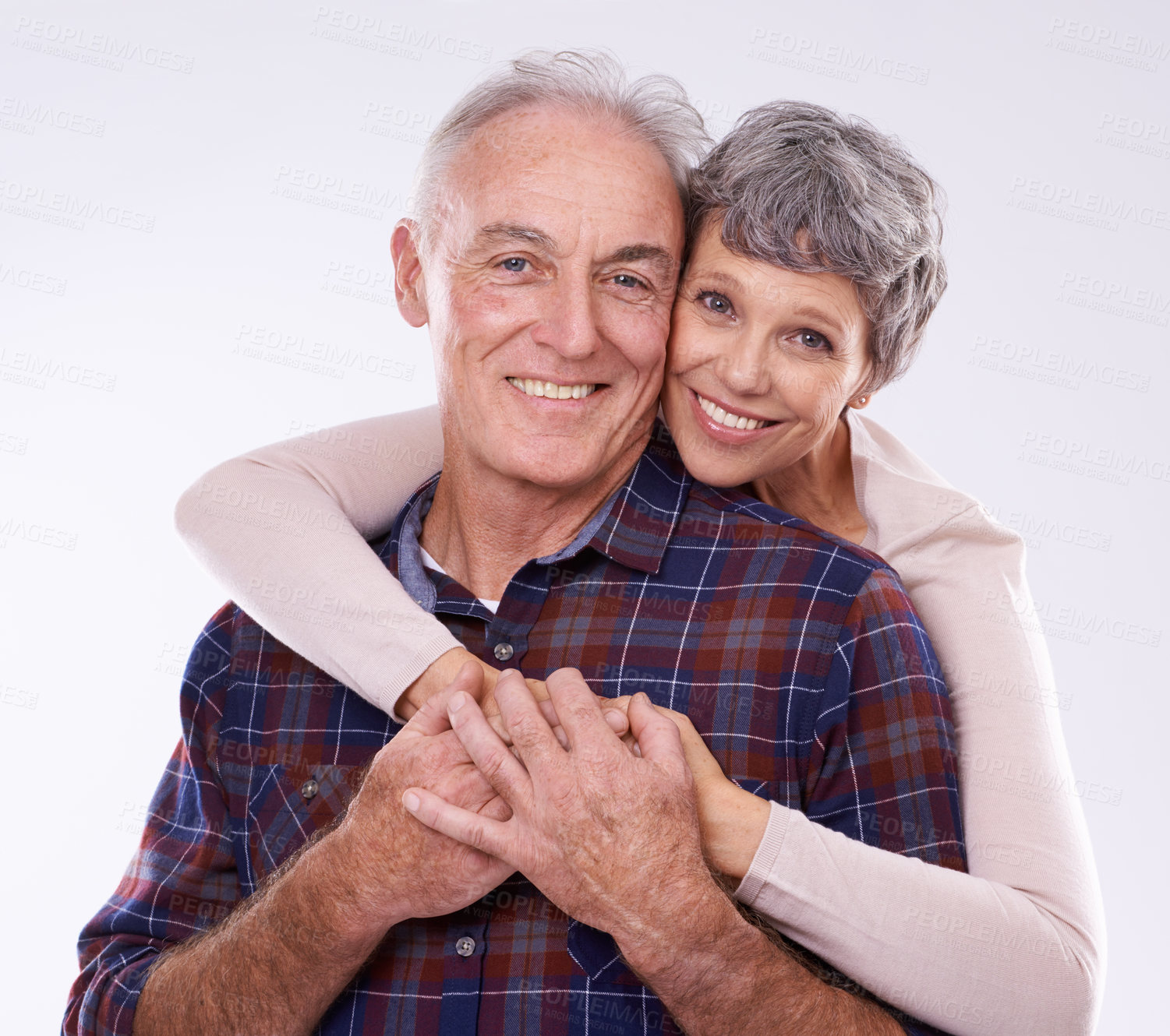 Buy stock photo Love, hug and portrait of senior couple on a white background for bonding, affection and loving relationship. Marriage, happy and mature man and woman embrace for commitment, trust and care in studio
