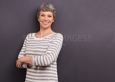 Buy stock photo Studio portrait of a confident elderly woman against a gray background