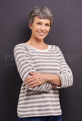 Buy stock photo Portrait, happy and senior woman with arms crossed, retirement and cheerful on a grey studio background. Face, elderly person and mockup space with old lady and pensioner with joy, calm and smile