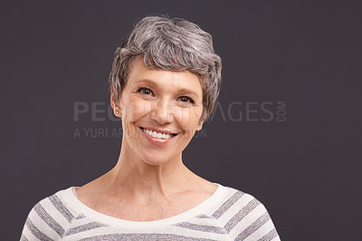 Buy stock photo Portrait, smile and senior woman with retirement, happiness and casual outfit on grey studio background. Face, pensioner or elderly person with mockup space and cheerful with clothes, peace or joyful