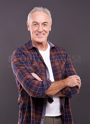 Buy stock photo Senior, fashion and man in portrait with crossed arms, confidence or modern style on grey background. Proud person, casual model and happy mature guy in studio with smile, clothes or pride in England