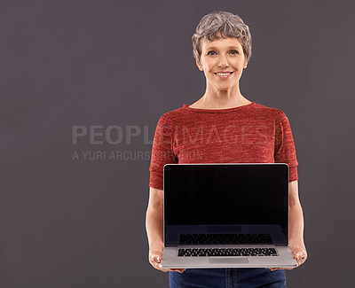 Buy stock photo Senior, woman and laptop screen in studio, technology and online search or typing and internet connection. Information, browse or social networking, elderly female person on mockup background