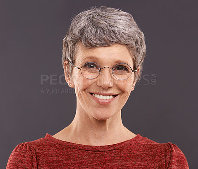 Buy stock photo Portrait, elderly woman and glasses with smile, clear vision and confident pensioner on a grey studio background. Face, old person and senior lady with eyewear and optometry with joy and retirement