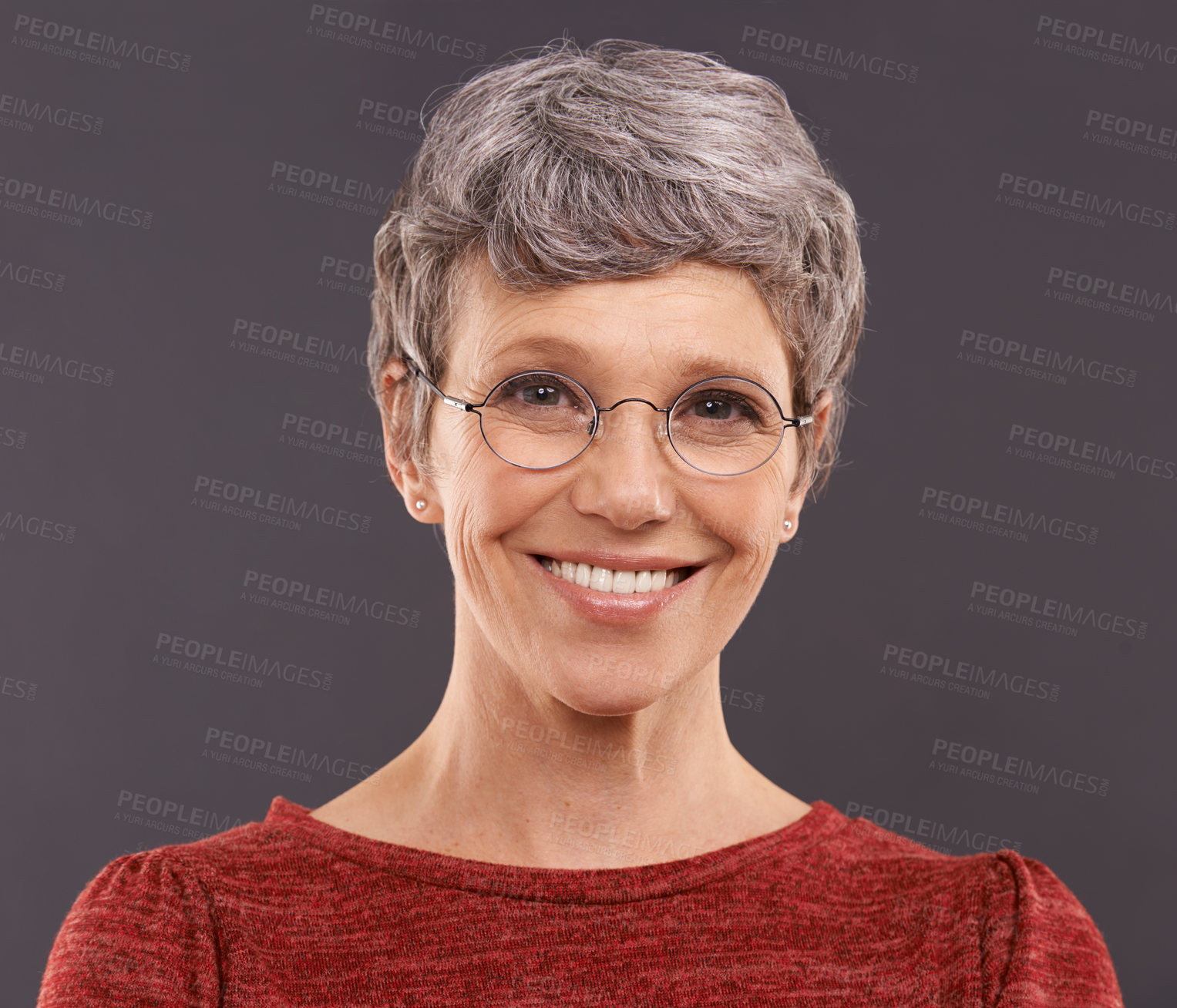 Buy stock photo Portrait, elderly woman and glasses with smile, clear vision and confident pensioner on a grey studio background. Face, old person and senior lady with eyewear and optometry with joy and retirement