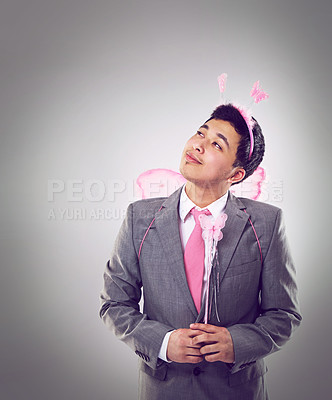 Buy stock photo Studio, costume and man thinking of magic in business as entrepreneur in corporate startup. Adult, male person and guy in suit, professional and fairy for Halloween party in company with smile