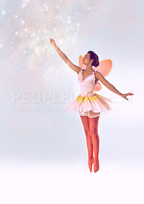 Buy stock photo A full length shot of a cute fairy casting a spell