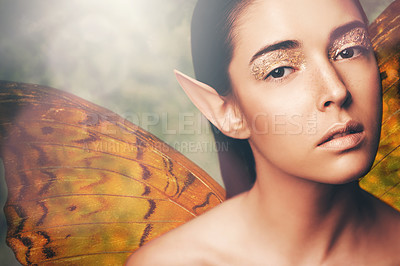 Buy stock photo Fairy, woman and wings in nature with makeup, portrait or glow for fantasy, dream or surreal story. Girl, magic and beauty with butterfly with creativity, art and glitter for cosmetics with mythology