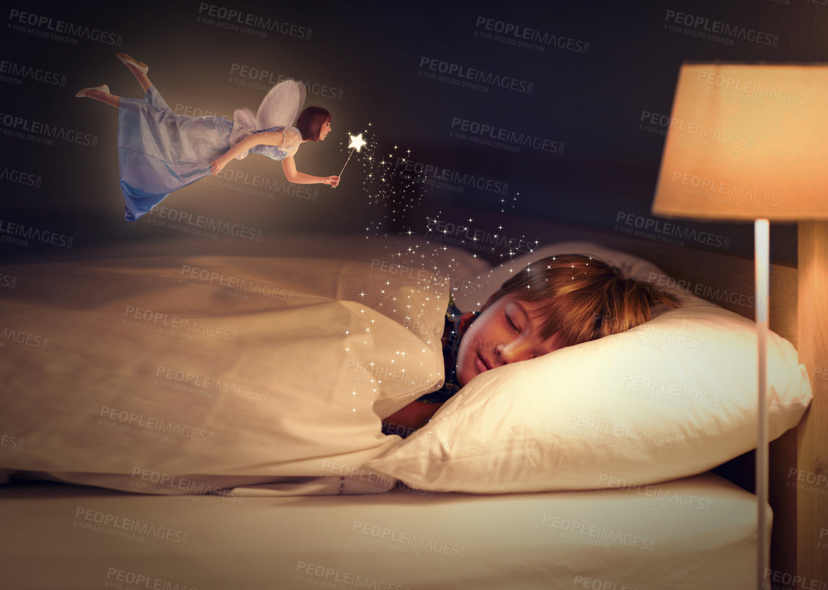 Buy stock photo Shot of a young boy sleeping peacefully while a fairy hovers above him