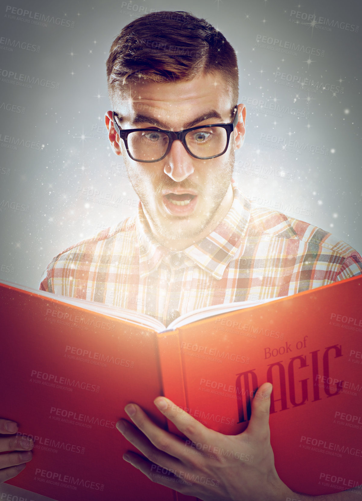 Buy stock photo Surprise, glowing pages and man with a book, reading and expression on grey studio background. Person, magic and reader with novel or literature with fantasy and shocked for story or wow with glasses