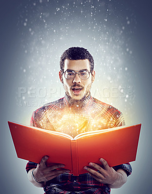 Buy stock photo Man, book and read for story, fairytale and wow facial expression for glowing and sparkle on mockup. Young person and shocked with glasses for omg, surprised and interesting for magic and fiction
