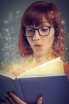 Buy stock photo Glowing pages, book and woman with a story, magic and education on grey studio background. Person, reader and girl with a novel and literature with knowledge and imagination with fantasy or astrology