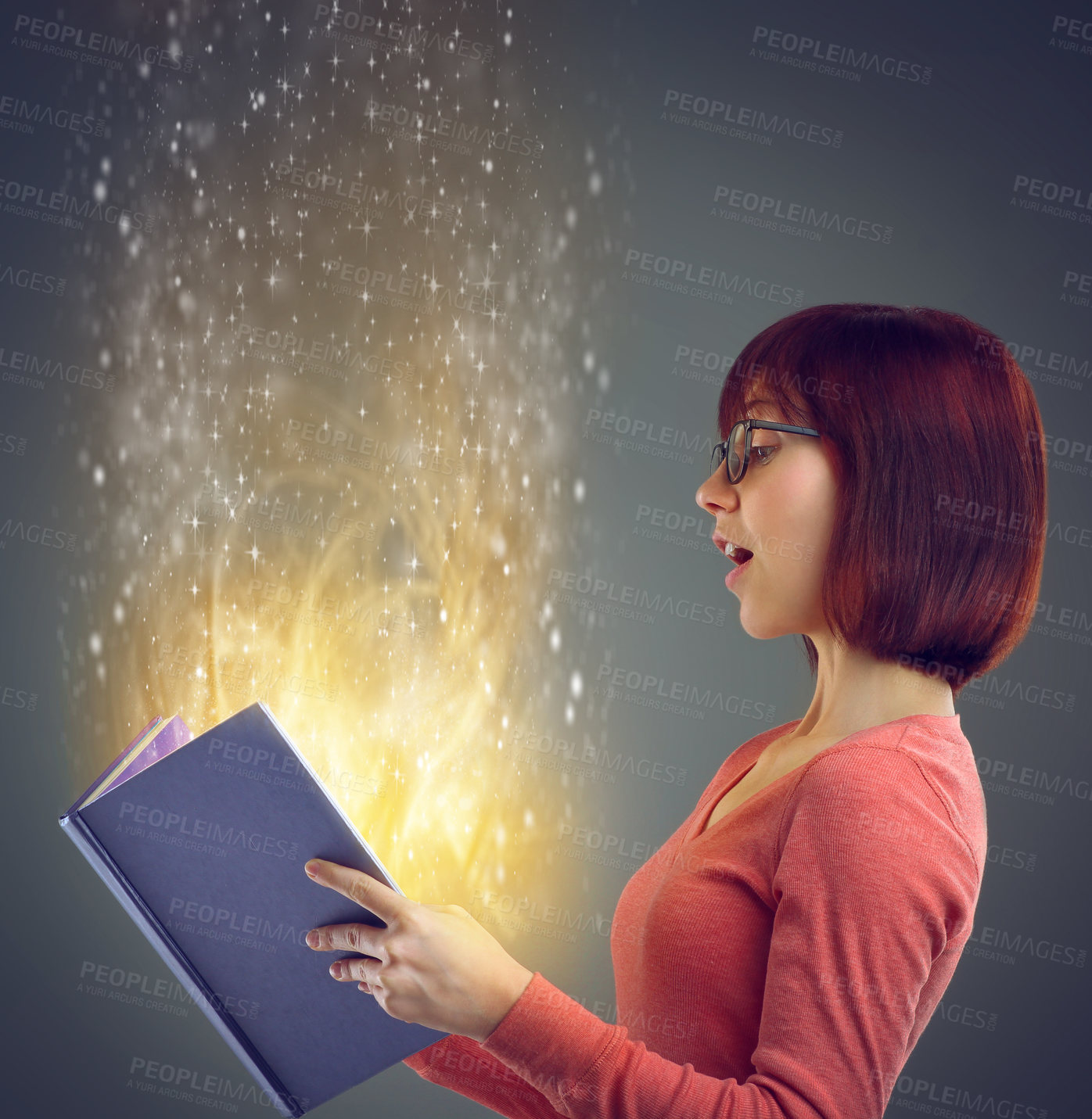Buy stock photo Profile, glowing book and woman with creativity, story and education on grey studio background. Person, model and girl with novel or literature with knowledge or learning with light, magic or fantasy