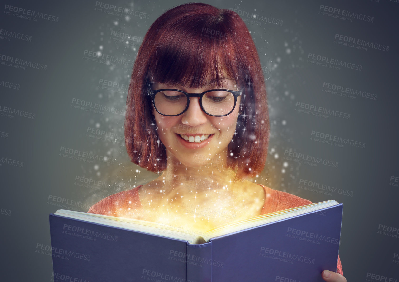 Buy stock photo Glowing pages, book and woman with a story, fantasy and education on grey studio background. Person, reader and girl with a novel and literature with knowledge or creativity with glasses or astrology