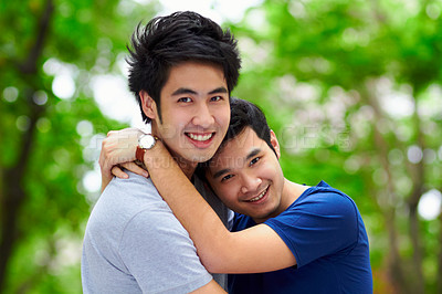 Buy stock photo Asian men, gay couple and hug by trees, portrait and woods with love, care and bonding in summer sunshine. Happy Japanese man, romance and relax together in forrest with lgbtq, nature and holiday