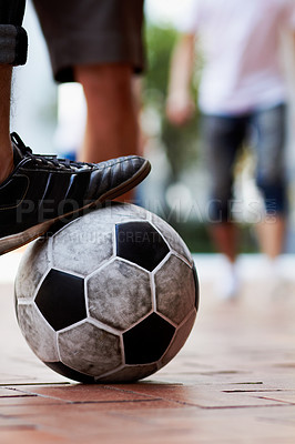 Buy stock photo Sports, street and feet of a person for soccer, game and training for athlete. City, sneakers and legs of a man with a football for sport, exercise and urban fitness in the road while playing a match