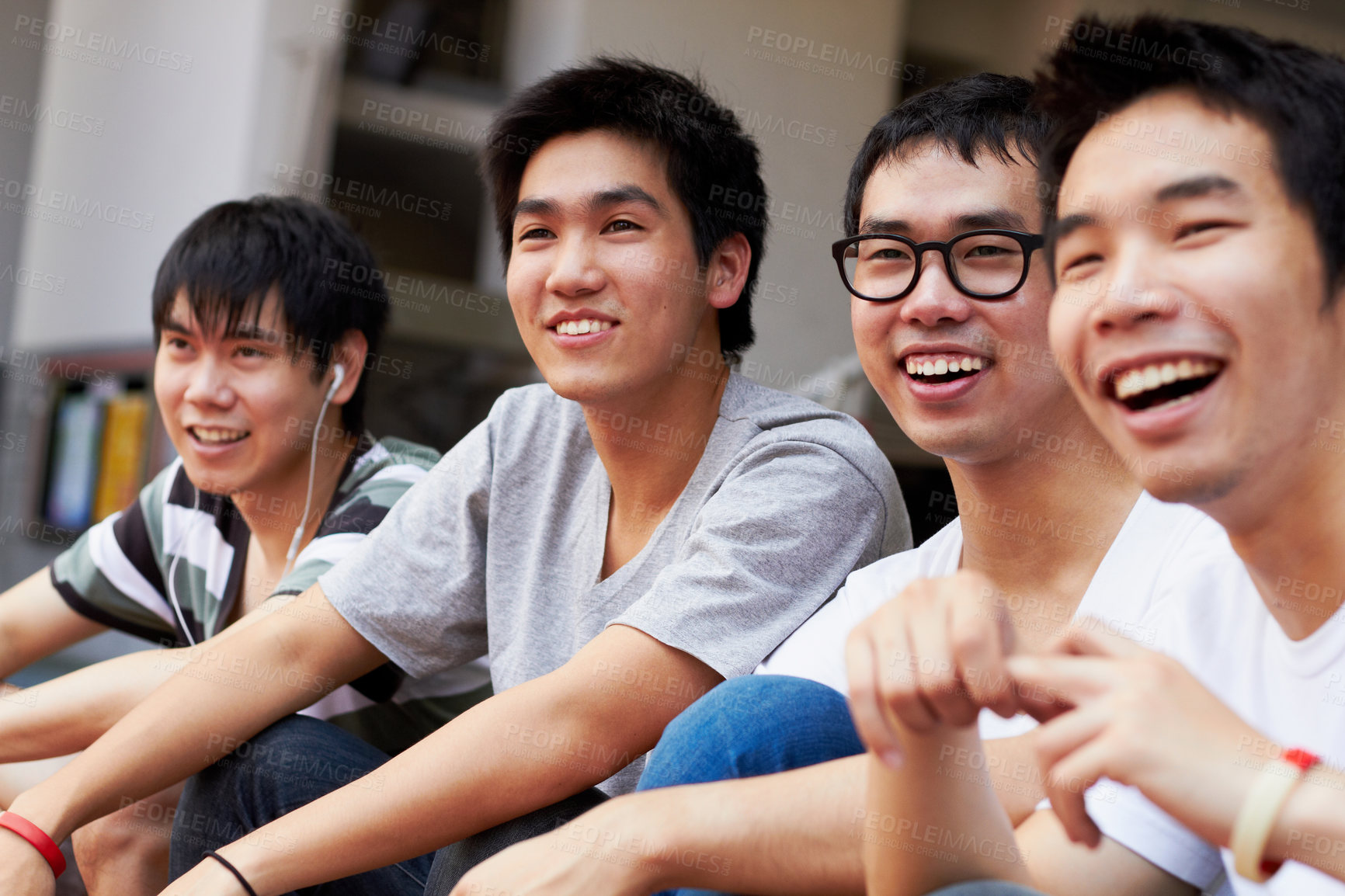 Buy stock photo Happy, relax and men together on the weekend for happiness, friendship and bonding. Smile, teenager and Asian friends laughing, talking and having fun while watching a soccer game or competition