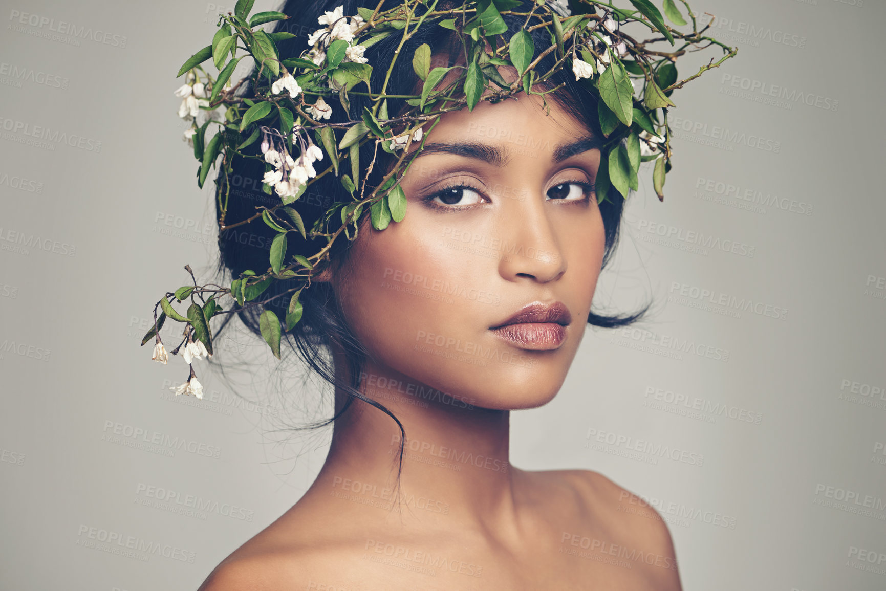 Buy stock photo Studio portrait of a beautiful young woman wearing a head wreath