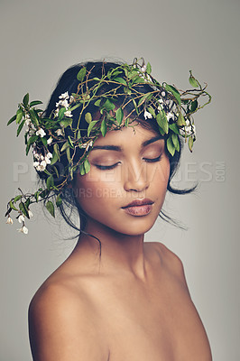 Buy stock photo Beauty, flowers and crown with a woman in studio on a gray background for natural skincare or treatment. Skin, nature and wellness with an attractive young female model wearing a flower wreath