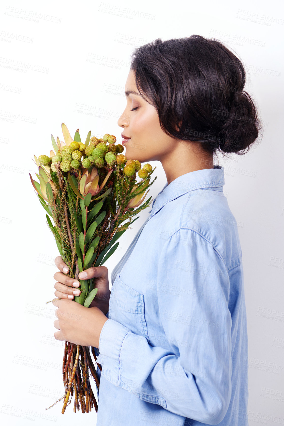 Buy stock photo Women, bouquet and flowers in studio for smell and botany for leaves with stem for bloom. Mexican lady and young person holding plant for spring, blossom and bunch for gift and green with eyes closed