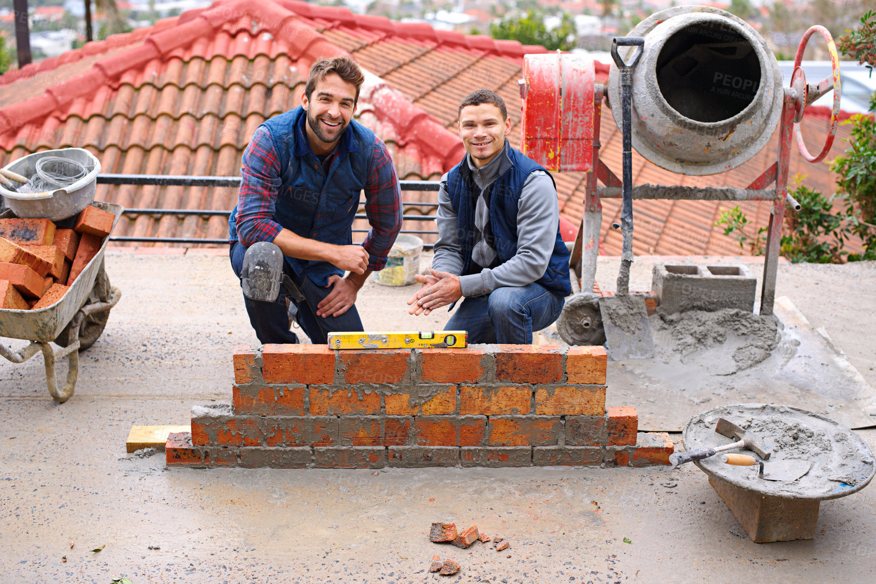 Buy stock photo Construction, bricklayer and men building a brick wall, handyman or contractor with trade, mentor and apprentice in industry. Team, builder and cement with tools, maintenance renovation for training