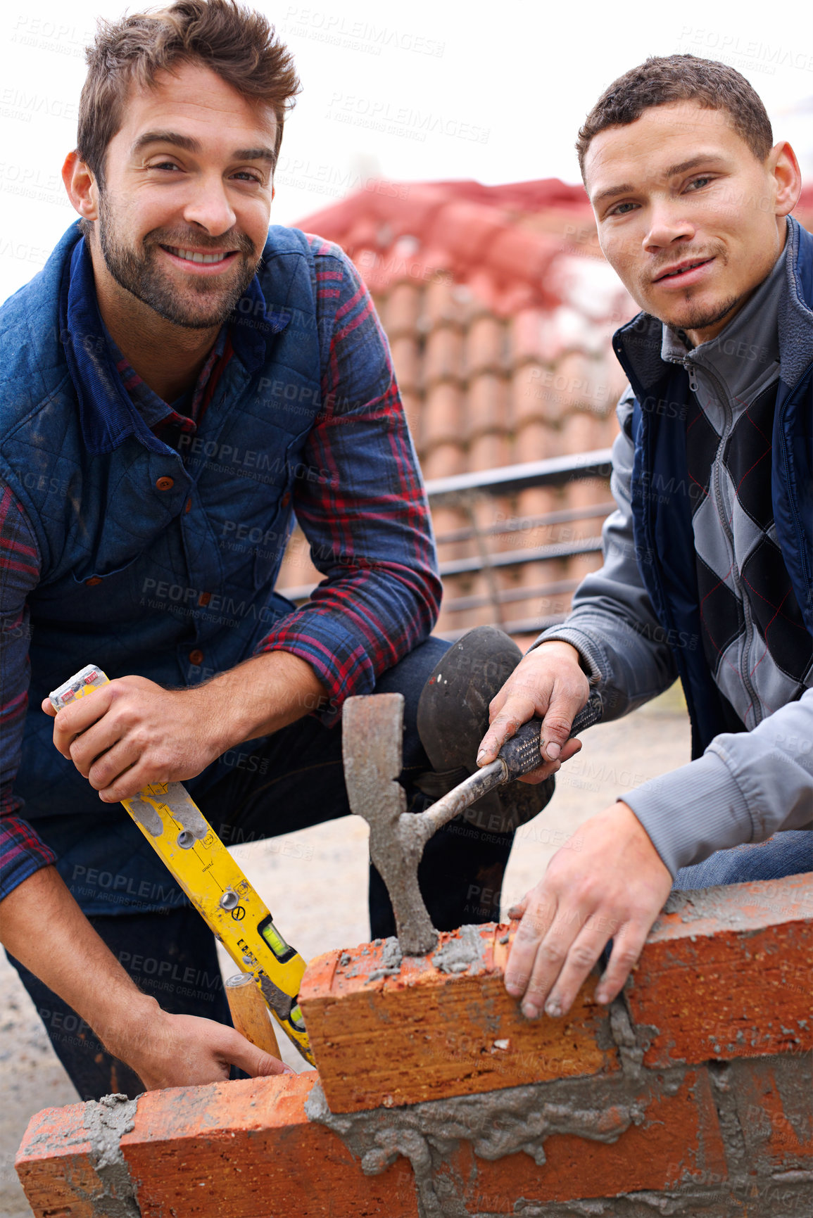 Buy stock photo Construction worker, bricklayer and men with tools for building a brick wall, handyman or contractor with mentor and apprentice. Team, builder with maintenance or renovation for training in industry
