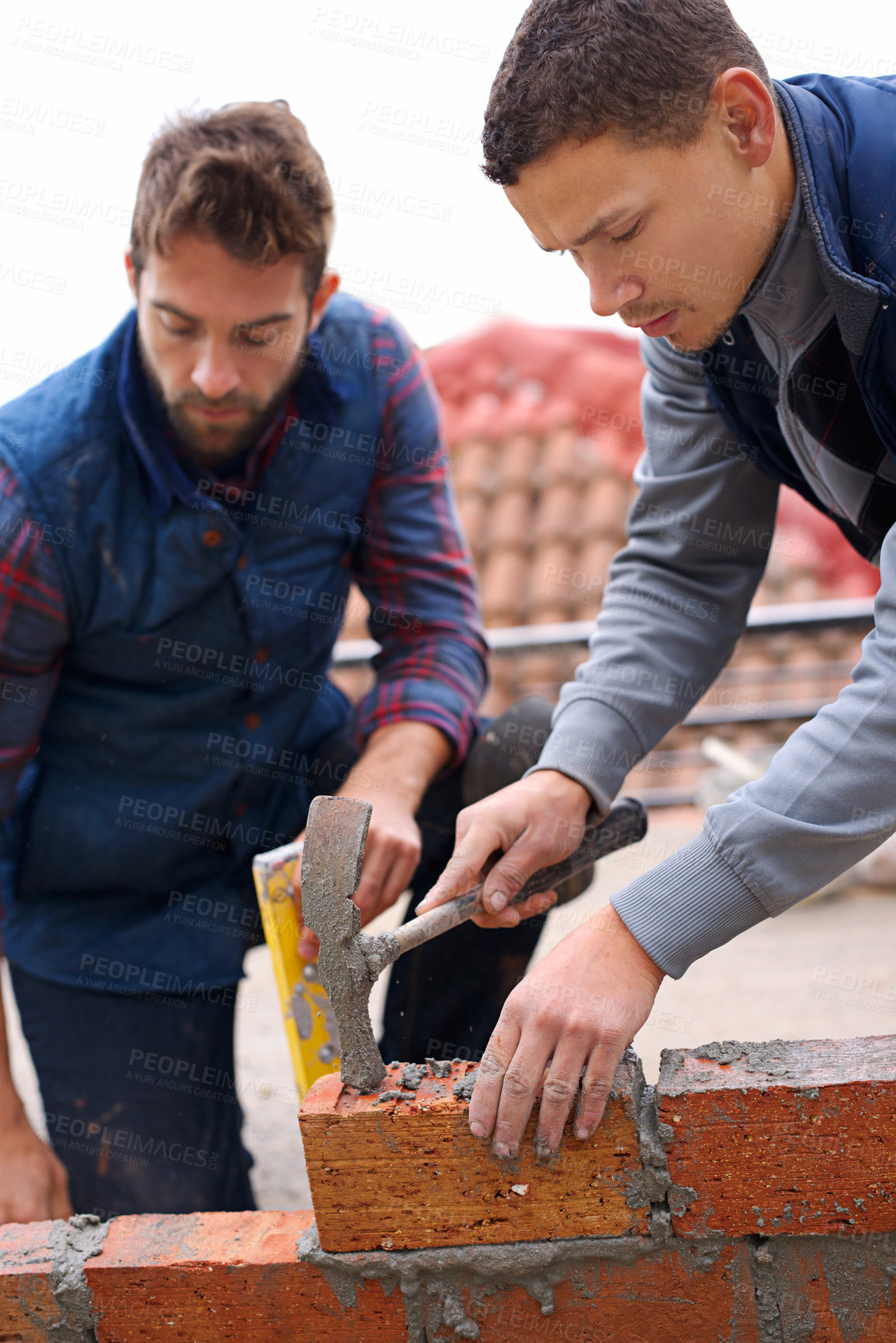 Buy stock photo Construction, bricklayer and men with tools for building a brick wall, handyman or contractor with trade, mentor and apprentice. Team, builder with maintenance and renovation for training in industry