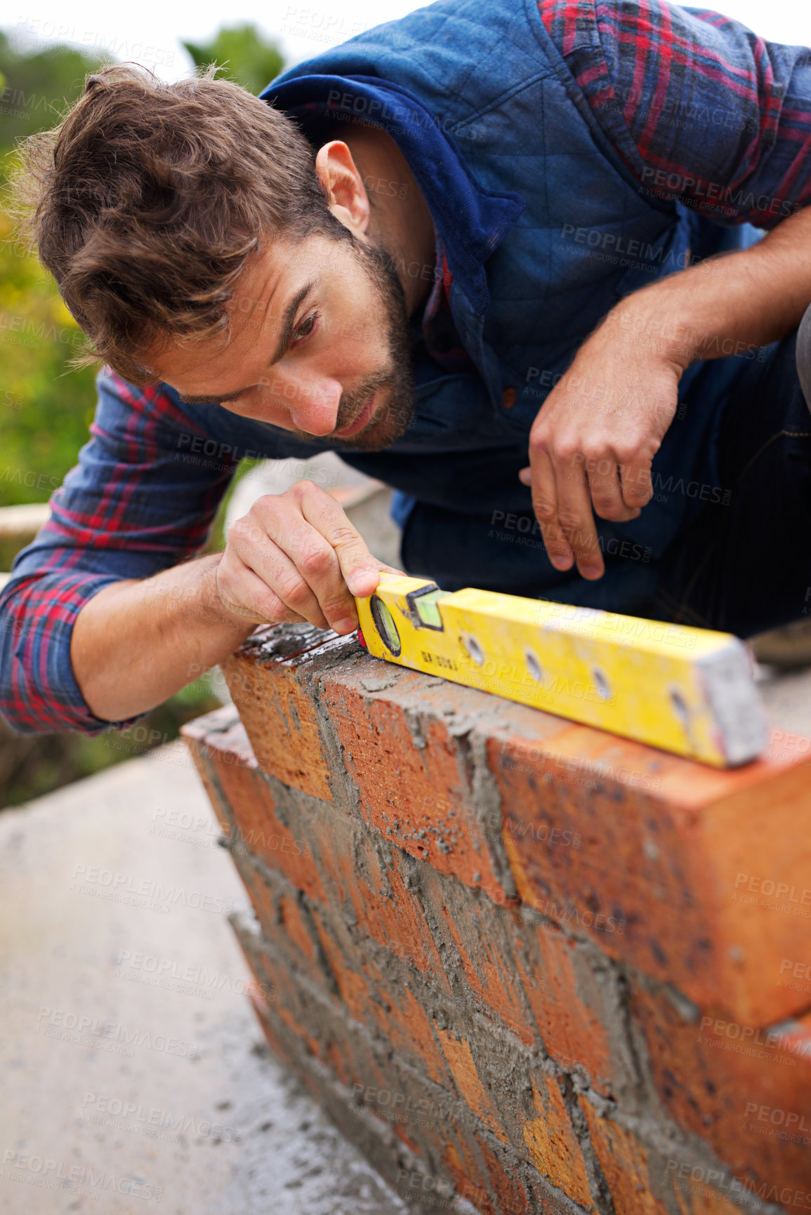 Buy stock photo Man, spirit level and construction for bricklayer, working employee in industrial industry and contractor career. Serious, male person and balance tool or handyman for renovation on building project
