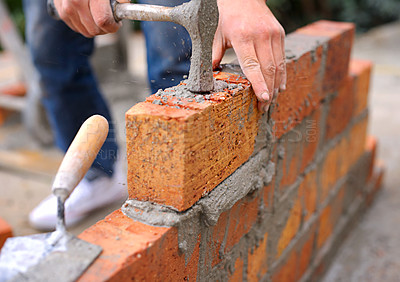 Buy stock photo Shot of a master bricklayer at work