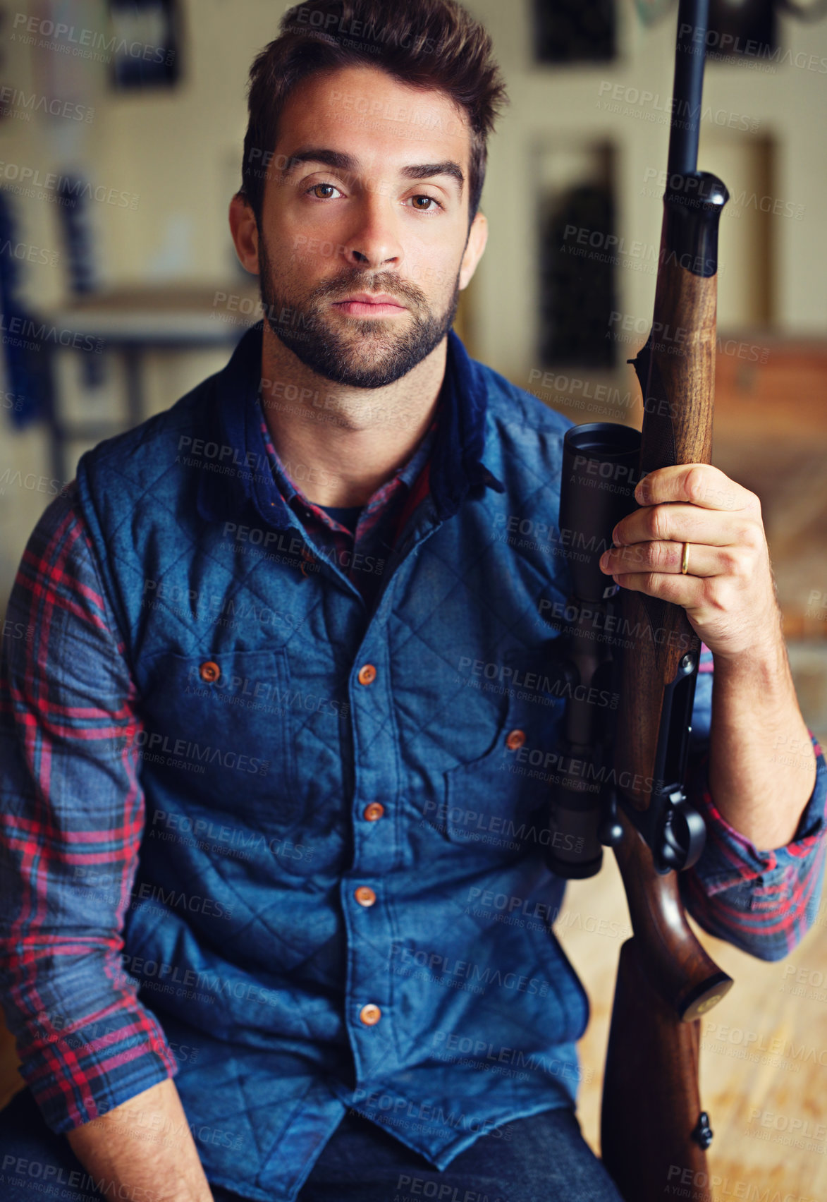 Buy stock photo Hunter, confidence and portrait of man with gun for game shooting, adventure and hobby in home. Sports, trophy hunting and serious face of person in cabin with rifle, pride and sportswear in home