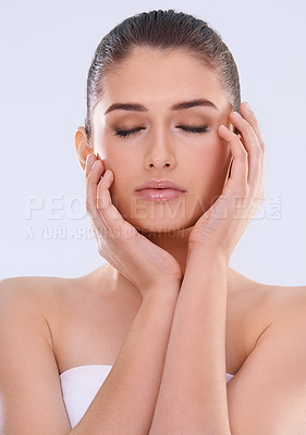 Buy stock photo Woman, eyes closed and hands on face for beauty, glow and wellness with dermatology for skin on white background. Natural cosmetics, skincare and calm with self care, shine and facial in studio
