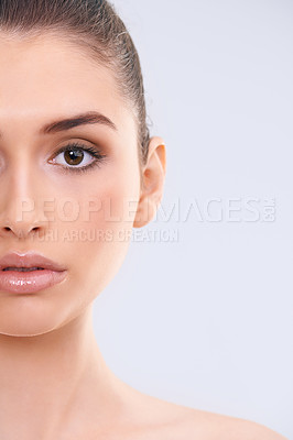 Buy stock photo Cropped studio portrait of a beautiful young woman with flawless skin