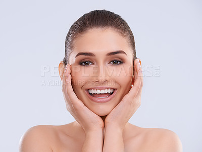 Buy stock photo Beauty, skincare and portrait of woman with hands on face, smile and benefits of cosmetics in studio. Dermatology, health and happy girl with natural makeup, glow and skin care on white background