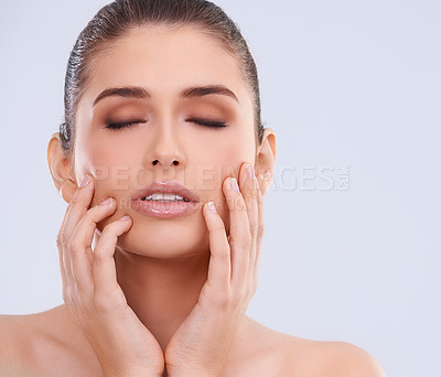 Buy stock photo Beauty, makeup and woman with hands on face, wellness and benefits of skincare in studio. Dermatology, luxury facial and girl with natural cosmetics, healthy glow and skin care on white background