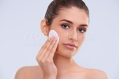 Buy stock photo Portrait, woman and cotton pad for makeup removal from skin, cosmetics and beauty product on white background. Skincare routine, cleanse and wipe face, dermatology and facial treatment in studio