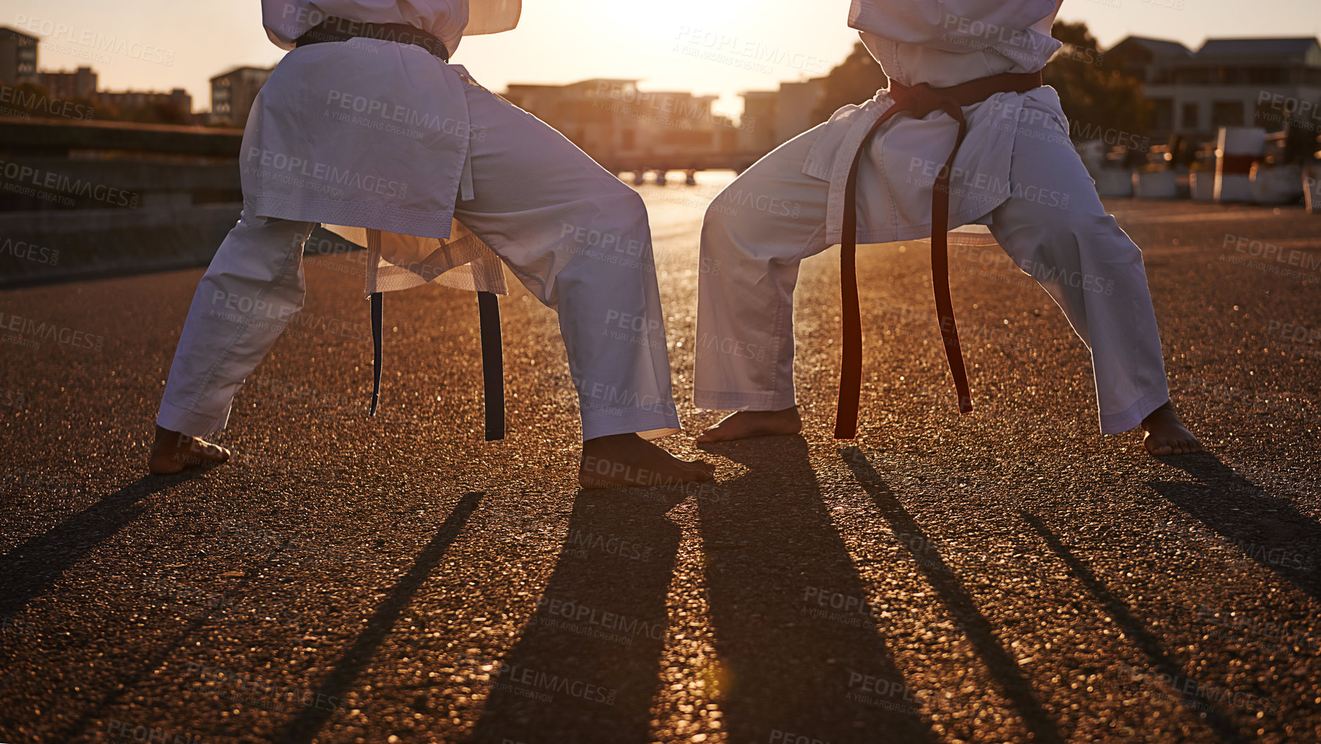 Buy stock photo People, karate and legs with martial arts in self defense, class or teaching in the city street. Outdoor fighter, athlete or sparring partner in fitness training, kata or technique in an urban town