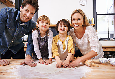 Buy stock photo Portrait, family and cooking pizza in kitchen together, counter with pastry or sauce for Italian food for supper. Smile, parents or children helping or support in preparation process in home for fun