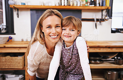 Buy stock photo A happy mother and daughter in the kitchen at  home